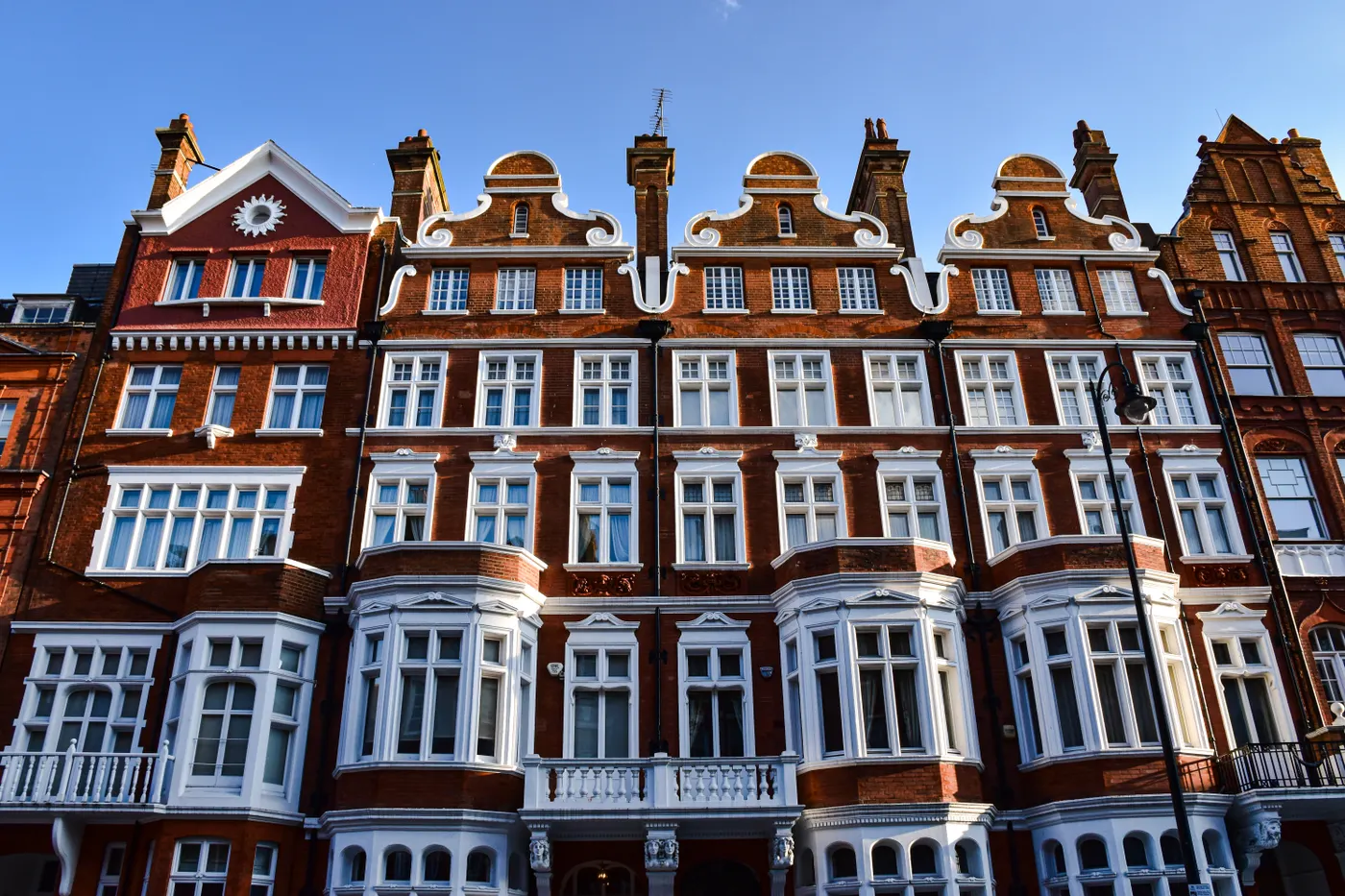 Red brick residential building with bay windows in London